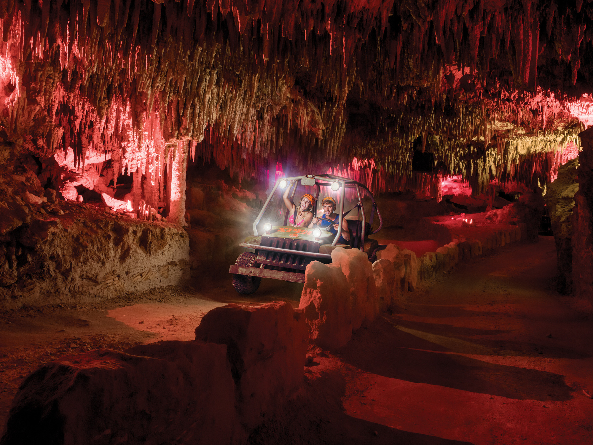 Couple atving in a cave at Xplor Fuego in Cancun