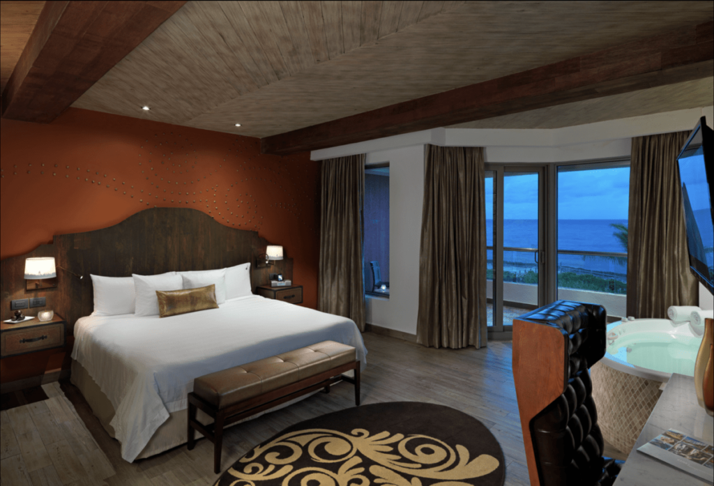 Brown Room with King Size Bed and Ocean View at the Hard Rock Hotel Riviera Maya