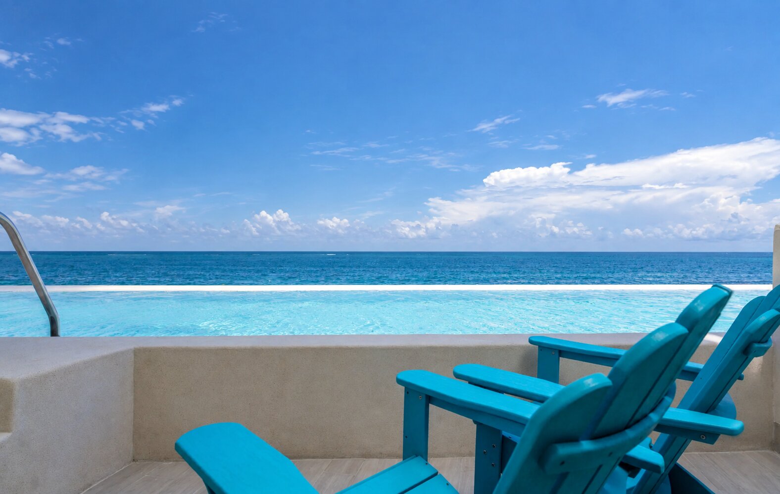 Oceanfront Paradise Swim-Up Studio patio with direct pool access at Margaritaville Island Reserve Riviera Maya