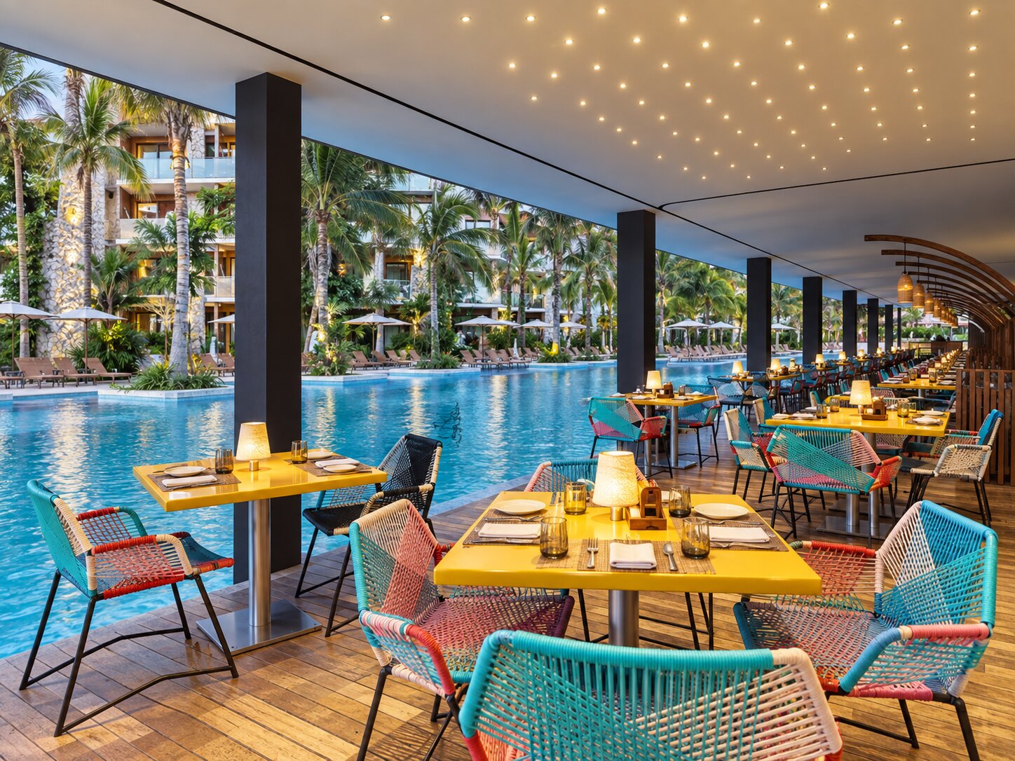 Poolside seating near Trajinera Bar at Hotel Xcaret Mexico