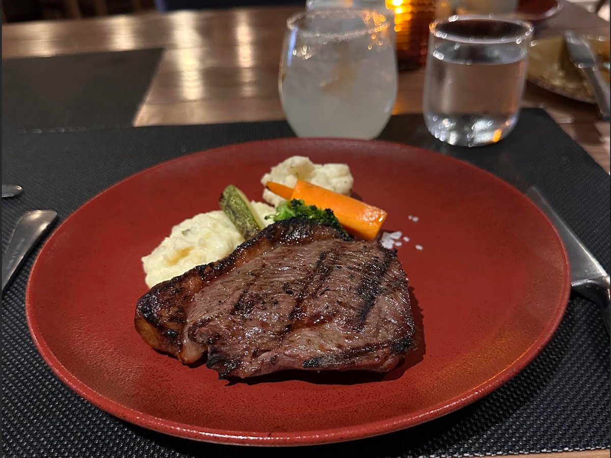 Steak with mashed potatoes and vegetables at JWB Steakhouse, Margaritaville Island Reserve Riviera Maya